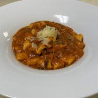 House Made Ricotta Gnocchi · Handmade ricotta gnocchi in our red bolognese meat sauce finished with mascarpone and shaved...