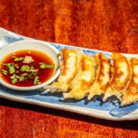 ぎࠂうざ`  / Gyoza · Homemade pan-fried chicken dumpling filled with cabbage and scallions. Side of ponzu soy sau...