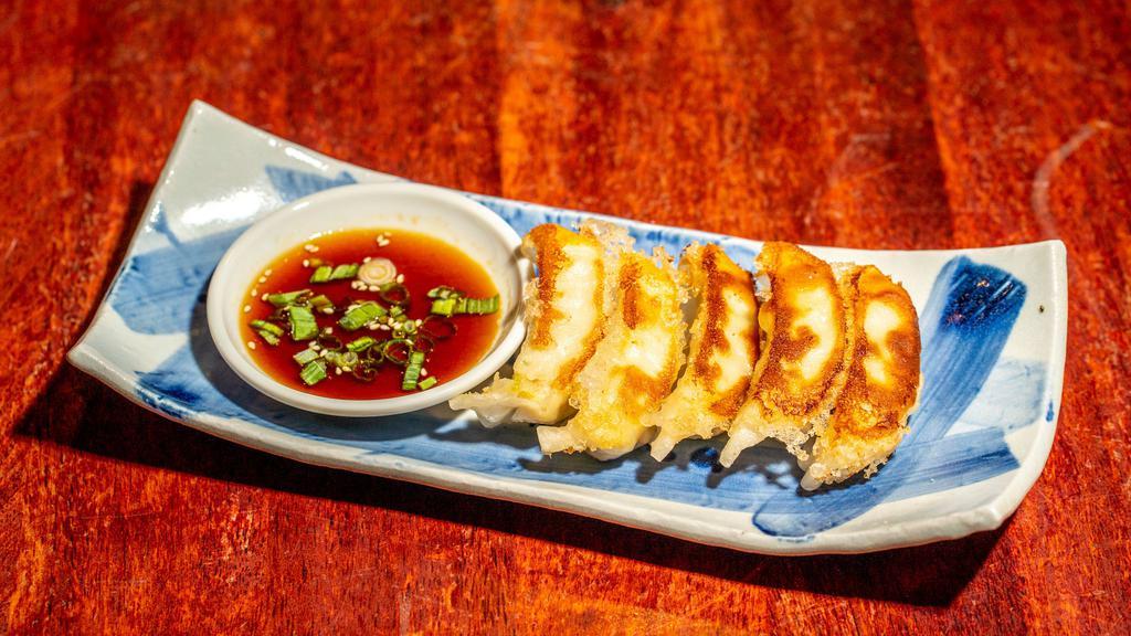 ぎࠂうざ`  / Gyoza · Homemade pan-fried chicken dumpling filled with cabbage and scallions. Side of ponzu soy sauce on side.