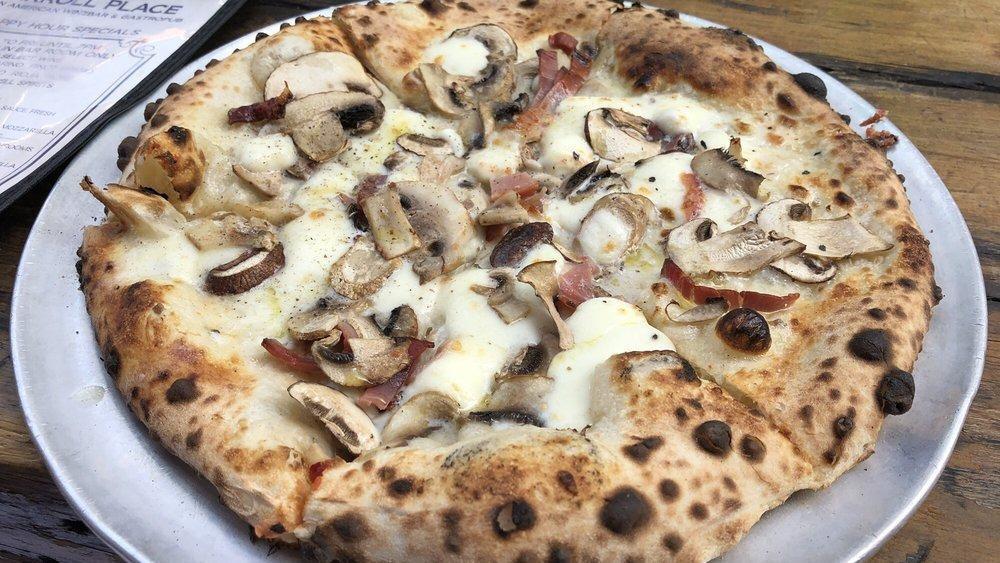 Tartufo Pizza · Fresh mozzarella, speck, mixed mushrooms, truffle cream, and truffle oil.