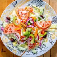 House Salad · Shredded cheddar cheese, tomatoes, cucumbers and seasoned croutons on a bed of crisp lettuce...