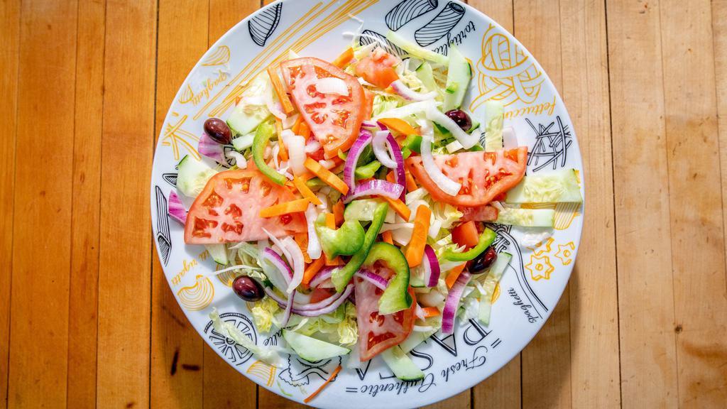 House Salad · Shredded cheddar cheese, tomatoes, cucumbers and seasoned croutons on a bed of crisp lettuce, served with your choice of dressing.