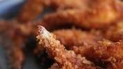 Coconut Shrimp · Golden, sweet, crispy coconut crusted shrimp served with our homemade sweet + spicy pineappl...