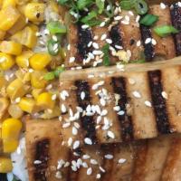 Flame Grilled Tofu · Locally sourced farm fresh tofu prepared with our house marinade.