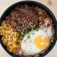 Loco Moco · Hawai’i Big Island style: 2 grilled beef patties topped with fried eggs, caramelized onions,...