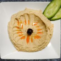 Hummus · Mashed chick peas blended with fresh garlic and tahini.