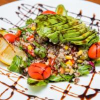 Quinoa Salad · Sliced avocado, corn, cucumber, red and green peppers, baby arugula and quinoa. Dressed with...