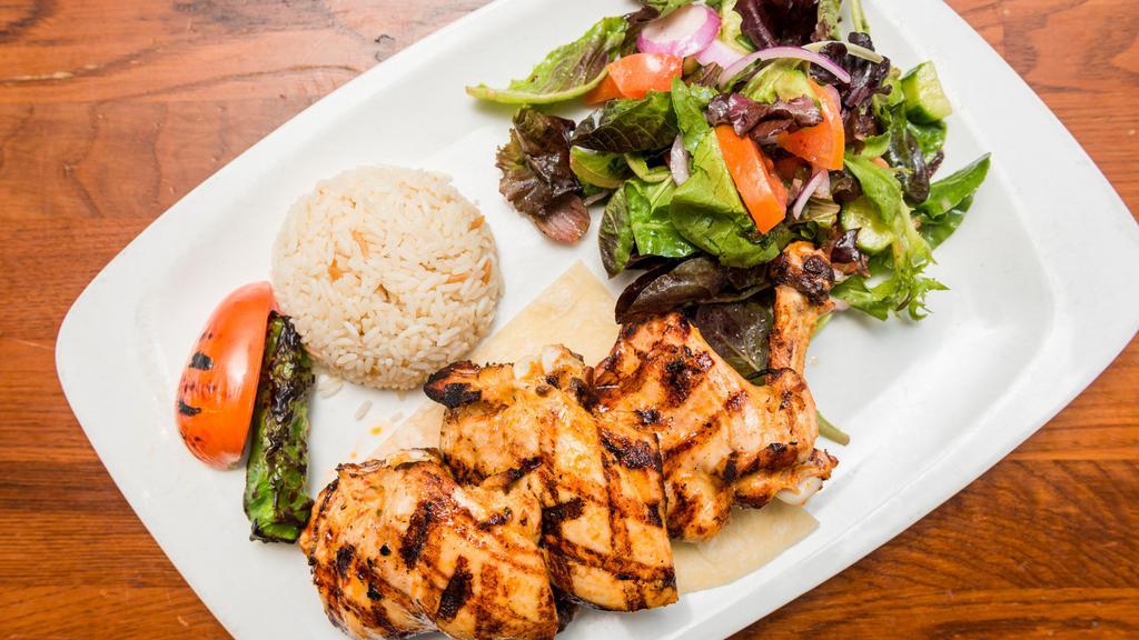 Chicken Chops · Marinated chicken thighs on the bone grilled to your taste. Served with rice and mixed green salad.