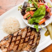 Rib Eye Steak (10 Oz) · Served with creamy mushroom sauce, rice and mixed green salad.