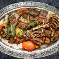 Mixed Grilled Rocca Special Plate · Four people. Combination of lamb and chicken. Served with rice and mixed green salad.