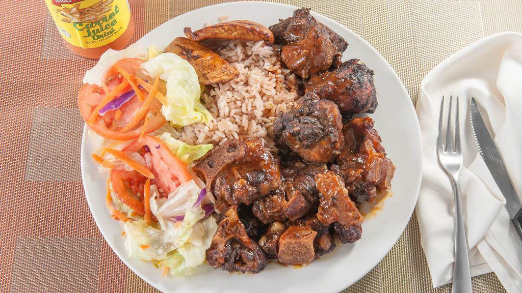 Oxtail Dinner · Served with rice & peas or white rice or yellow rice, salad or steamed cabbage