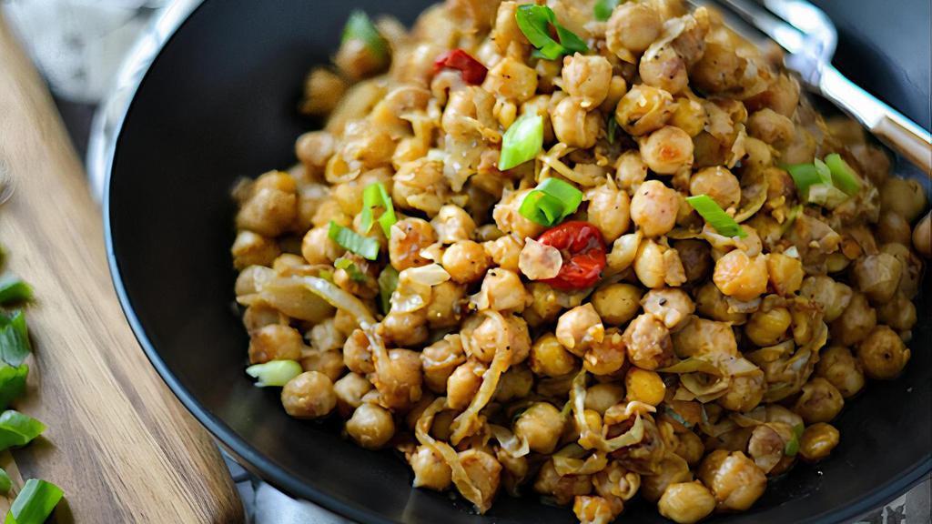 Channa Serving - Plain · Channa the Hindi name for chickpea is a very popular dish. This is an easy, quick dish to make the chickpeas are sautéed with onions, garlic, tomatoes, peppers, & thyme. It's enjoyed for breakfast, lunch, dinner & all times in between.