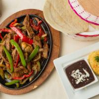 Fajitas · Grilled chicken, steak or shrimp served with onions, peppers, and mushrooms. Serve with rice...