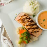 Grilled Salmon · Served mash potatoes and asparagus, topped with a lobster sauce.