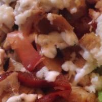 Fajita Salad · Served in a crispy flour shell, filled with crispy lettuce, sautéed bell peppers, and onio...