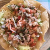 Ceviche Salad · Served in a crispy flour shell filled with crispy lettuce. Topped with a combination of sh...
