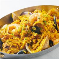Paella Basquez · Gluten free. Shrimp, mussels, clams, calamari, chicken, and spicy chicken sausage.