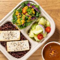 Vegan Combination · 100% vegan, organic tofu with mild massaman curry, cucumber salad, and kale salad with ginge...