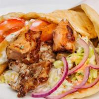 Grilled Chicken Gyro · With grilled chicken, lettuce, tomato, onion, and tzatziki sauce, on pita bread.  Served wit...