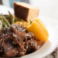 Oxtail · Includes choice of two side orders plus cornbread.