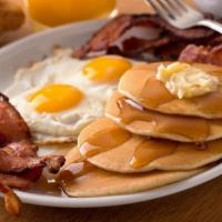 Pancakes With Two Eggs & Bacon · Delectable pancakes with two sunny eggs and crisoy bacon.