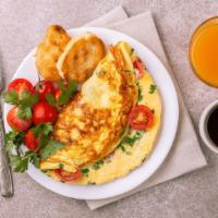 Western Omelette · Three  egg omelette bite delight with western style seasonings served with home fries and to...