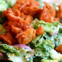 Blue On Buffalo Chicken Salad · Fresh salad with bleu cheese, romaine lettuce, buffalo chicken, banana peppers, diced tomato...