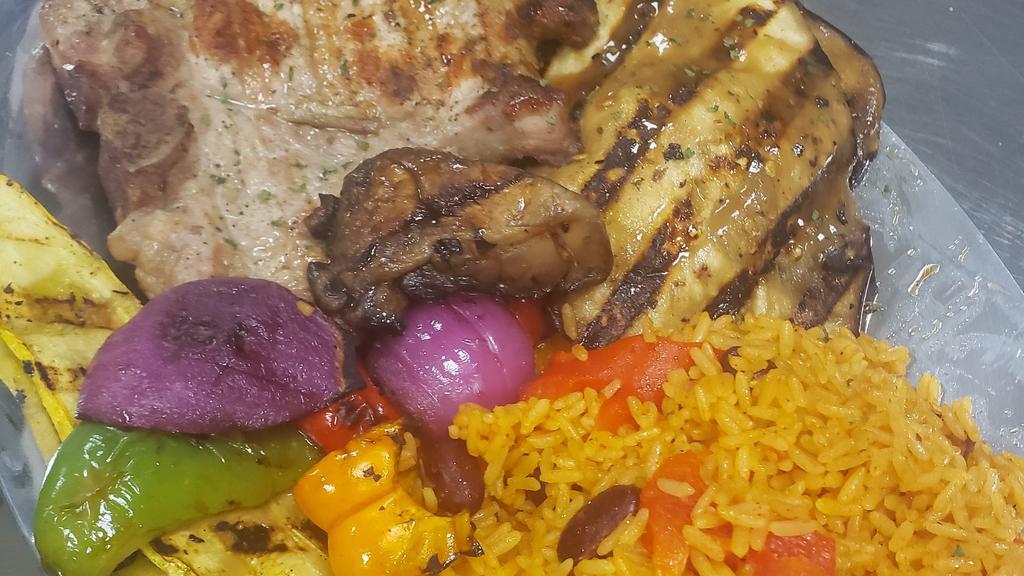 Pork Chop · Served With a Side of Salad, Rice, and Beans.