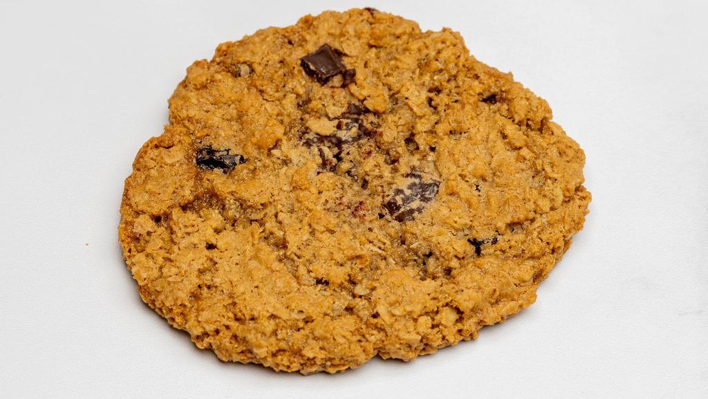 Oatmeal Chocolate Chunk Cookie · Vegan, gluten-free. A sweet and savory snack for the healthier you! Ingredients: Certified Gluten-Free Rolled Oats, Certified Gluten-Free Oat Flour, Organic Vegan Butter (soy free), White Sugar, Brown Sugar, Non-dairy chocolate chunks, Organic Black Raisins, Unsweetened Applesauce, Baking Soda, Vanilla & Cinnamon.