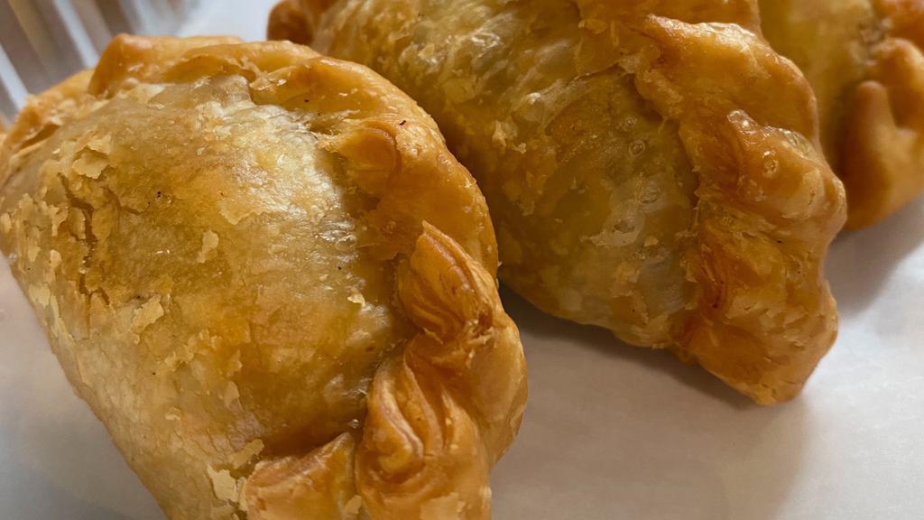 Curry Puffs · 3 pieces. Ground chicken with potatoes, onions, and yellow curry powder filling in fresh pastry, deep-fried, crispy.