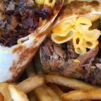 The Jurassic Pork · A grilled stuffed BBQ-Rito with pulled pork, mac & cheese, bbq baked beans, applewood smoked...