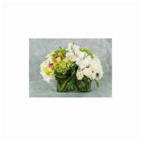 White And Green Classic
 · A stunning mix of white and green flowers in a low oval glass vase.

Flowers and vase subjec...