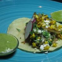 Nopales & Corn · Sautéed nopales, corn, and onions topped with cilantro, queso fresco and radish