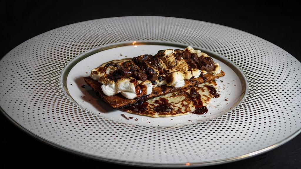 S'Mores Taco · Churro tortilla with graham crackers, chocolate, roasted marshmallows and chocolate drizzle