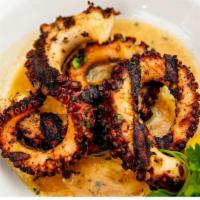Oktapodi Sharas · Charcoal grilled, red wine marinated octopus.