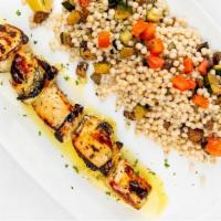 Souvlaki Kotopoulo · Grilled chicken & fennel kebab with vegetable couscous extra virgin olive oil.