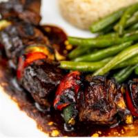 Filet Mignon · Charcoal-grilled kebab of filet mignon served with rice & string beans.