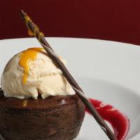 Chocolate Lava Cake. · chocolate cake with a soft double rich chocolate center | raspberry coulis | chocolate sauce...