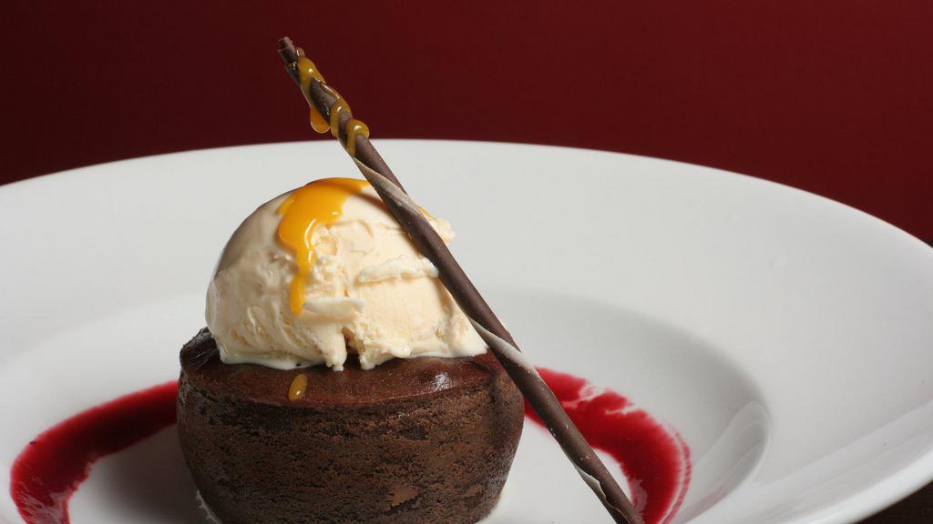 Chocolate Lava Cake. · chocolate cake with a soft double rich chocolate center | raspberry coulis | chocolate sauce | vanilla ice cream