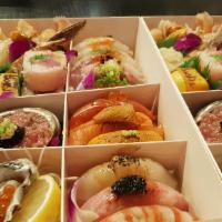 Omakase Sushi Sashimi. · It is not extra large platter. 
Omakase is designed for quality, presentation than quantity....