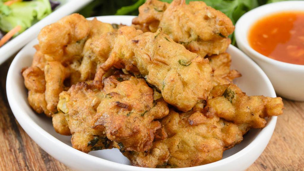 Veg Mix Pakora · Seasonal vegetable medley dipped in gram flour fried to perfection.