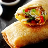 Vegetable Kati Roll · Julienne mix vegetables sautéed to perfection with a touch of spice rolled in our fresh naan.