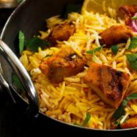 Chicken Biryani · Delicious basmati rice with fresh vegetables, boiled eggs, homemade spices and mint leaves.