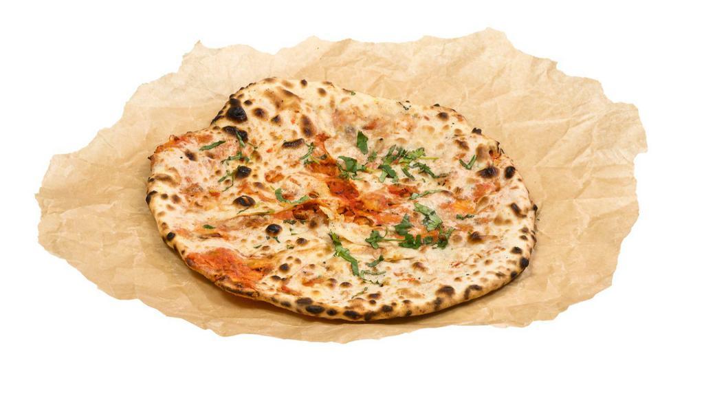 Makhani Naan · Fresh plain bread with butter.