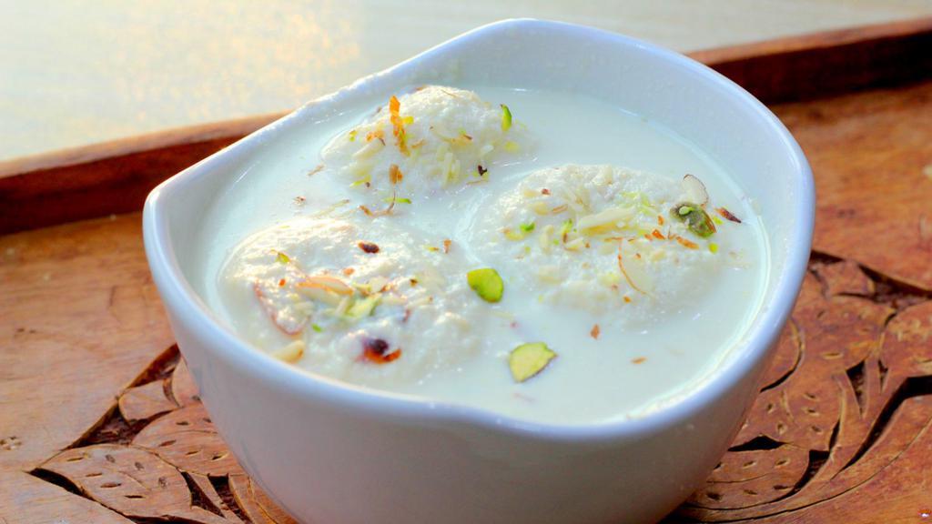 Rasmalai · Delicious sweet cottage cheese dumplings flavored with saffron and cardamom.