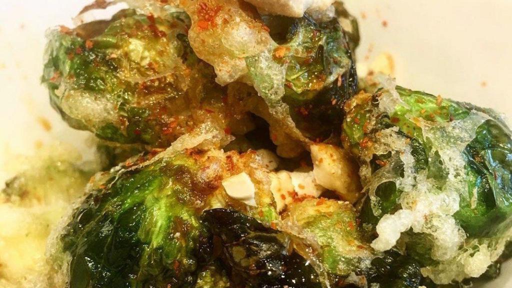 Crispy Brussel Sprouts · Battered and deep fried brussel sprouts with homemade sweet and sour soy sauce and red pepper powder contains egg