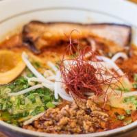 Miso · Chicken and bonito fish broth, wavy flat flour noodles, sliced pork belly, ground pork, scal...