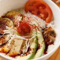 Taka’S Vegan · Vegetable broth with soy milk, wavy flat flour noodles, avocado, zucchini, tomato, mushrooms...