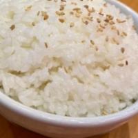 Koshikari White Rice · Golden koshihikari premium rice bowl with sesame seeds.
