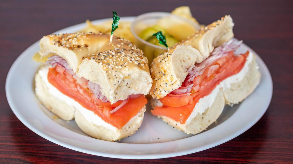 Sliced Nova Sandwich · With cream cheese, onions, tomatoes, capers.